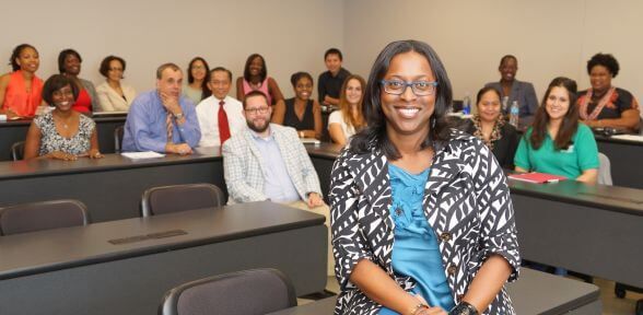 School of Education professor with classroom of graduate students at University of St. Thomas in Houston, Texas