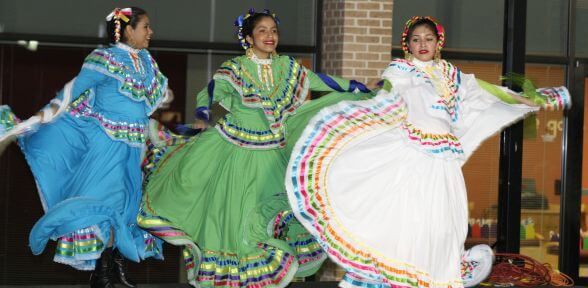 Undergraduate students having fun at International Festival on the campus of the University of St. Thomas in Houston, Texas