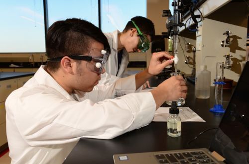 Undergraduate male chemistry students in the STEM Center for Science and Health Professions at the University of St. Thomas in Houston, Texas