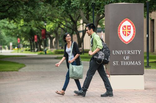 Two students walk on the University of St. Thomas - Houston campus