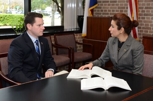 Two University of St. Thomas - Houston finance students meet in the conference room