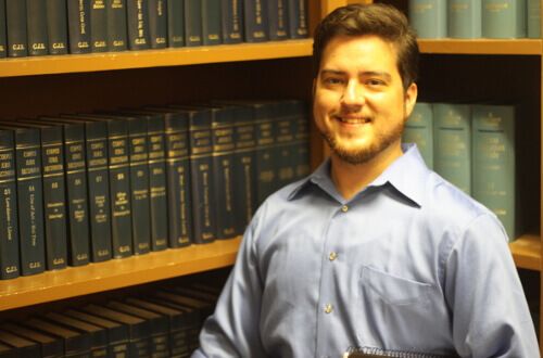 University of St. Thomas - Houston student in Political Science library