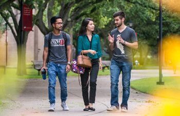 Three University of St. Thomas - Houston Math majors walk across campus