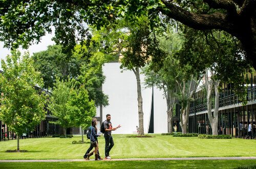 Students walk in front of Chapel of St. Basil on University of St. Thomas - Houston campus