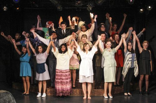 Large group of University of St. Thomas - Houston students take their bows after performance