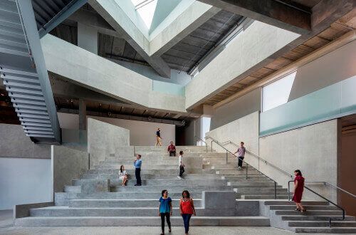 University of St. Thomas - Houston BA in Studio Arts students walk through the atrium of the Glassell School of Art