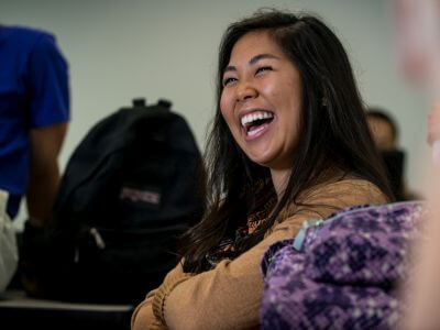 Psychology major laughs during University of St. Thomas - Houston class