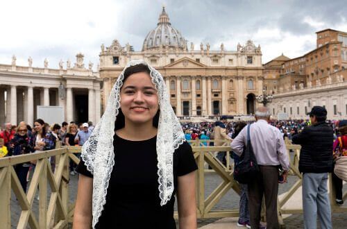 University of St. Thomas - Houston study abroad student in front of scenic building in Rome