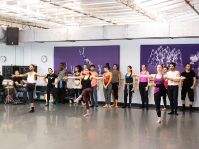 Three University of St. Thomas - Houston Dance students practice in the studio