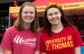 Students in University of St. Thomas - Houston T-shirts on campus
