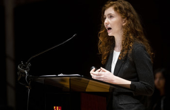 University of St. Thomas - Houston Honors Program student gives speech at podium