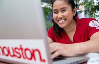 University of St. Thomas - Houston MSN Degree Program - student working on laptop